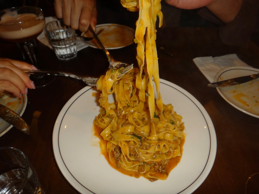 Close-up of a pasta dish with hidden shellfish dishes unexpected by diners managing seafood allergies at restaurants