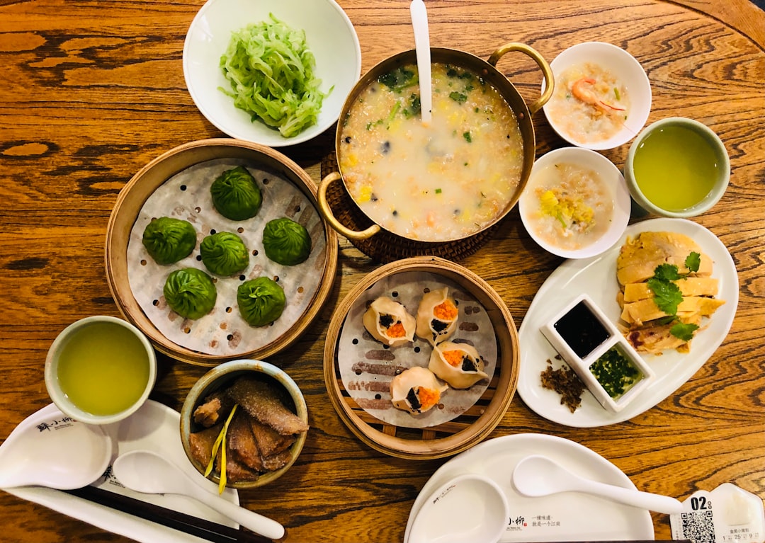 A spread of traditional Chinese dishes on a restaurant table, highlighting the challenges of soy allergy Chinese restaurant dining safely