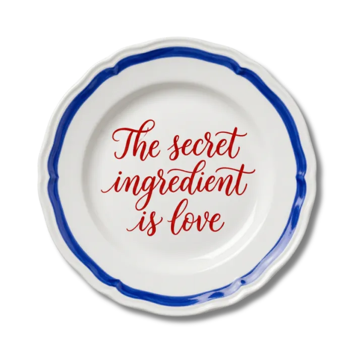 Ceramic plate hand-lettered “The secret ingredient is love”